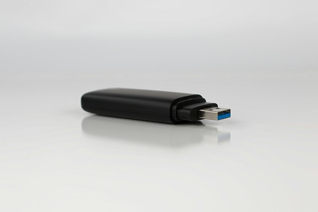 a close up of a usb device on a white surface