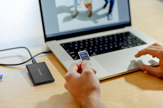 A person sitting in front of a laptop computer